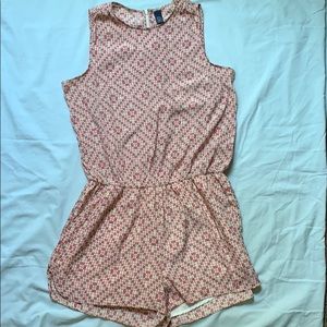 Multi-colored romper with pockets.